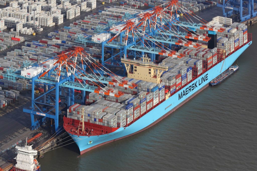 mega container ship unloading containers at a terminal